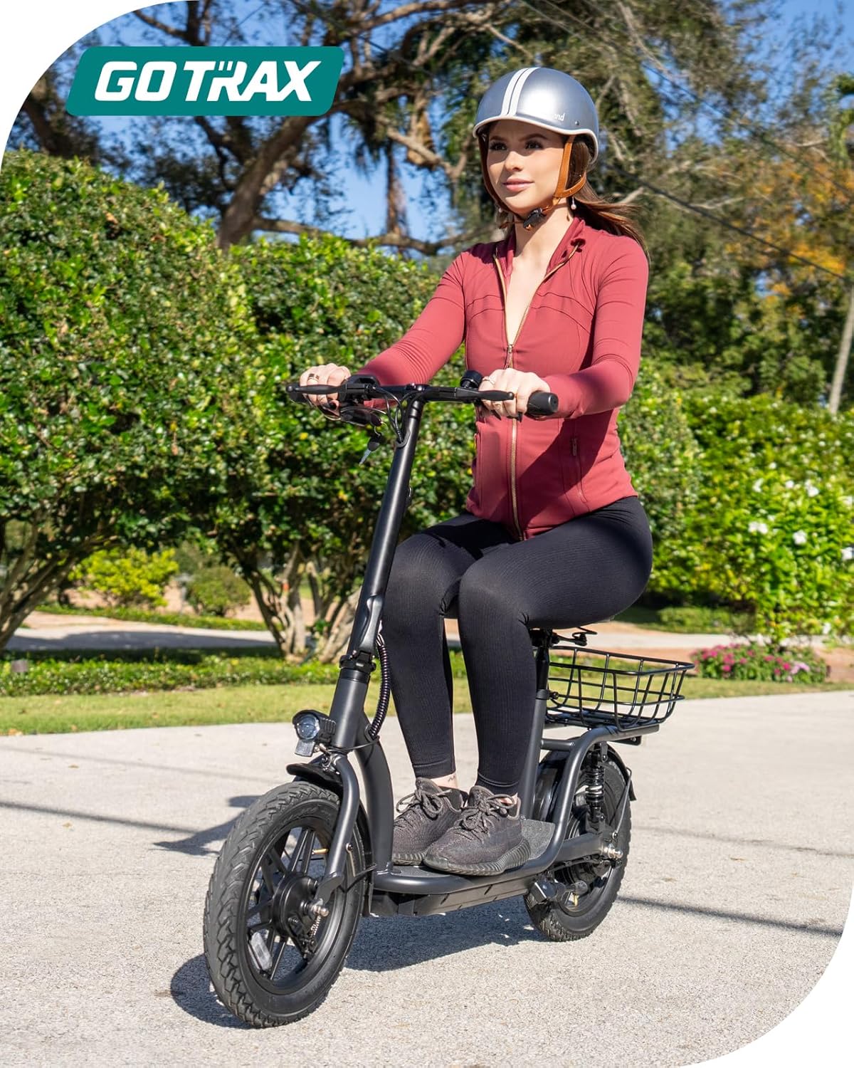 Gotrax adult electric scooter with seat maximum range of 19-25 miles all-terrain tires wide pedals wourant