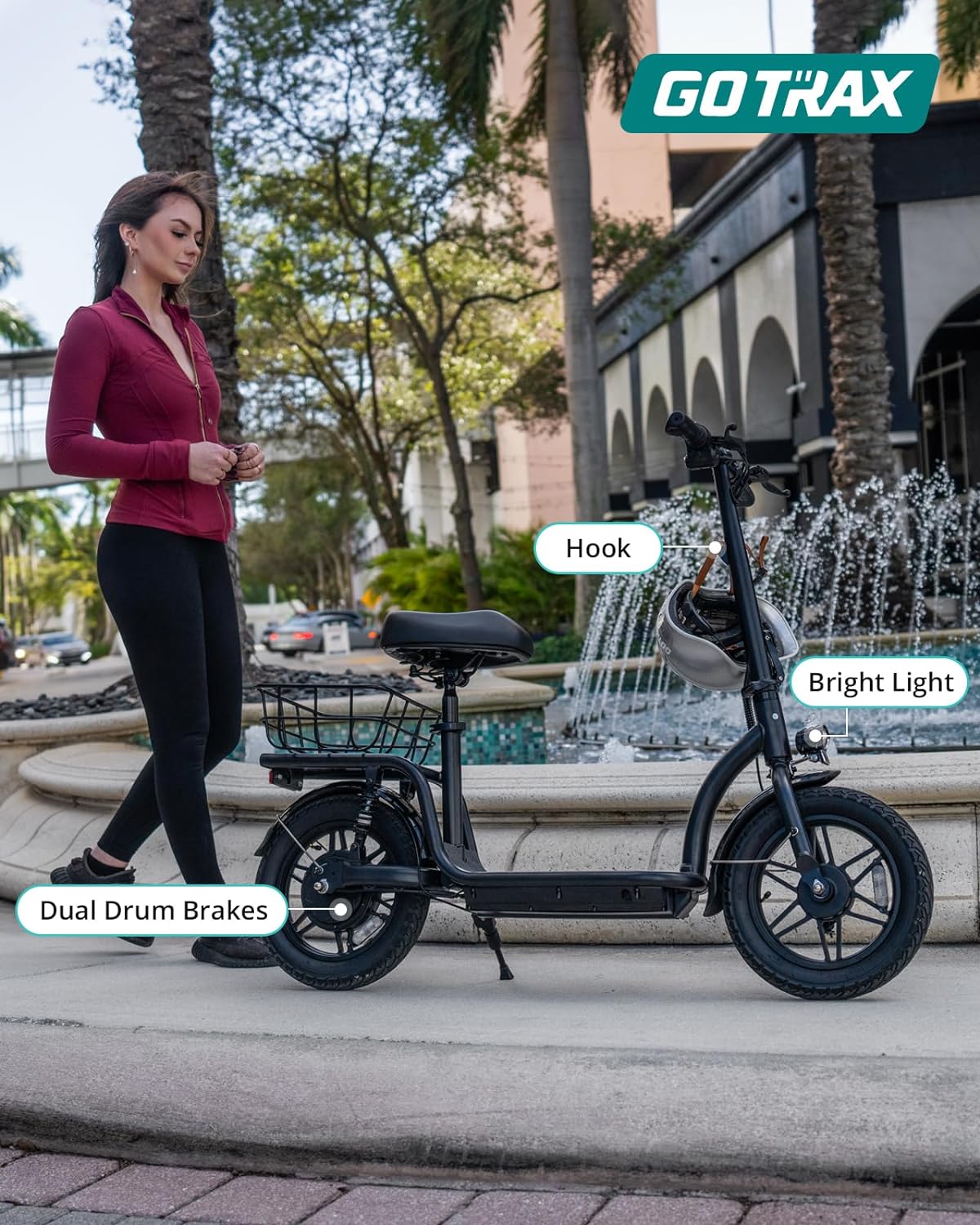 Gotrax adult electric scooter with seat maximum range of 19-25 miles all-terrain tires wide pedals wourant